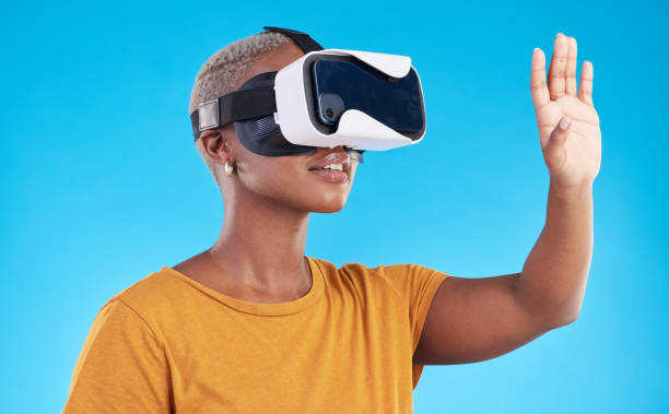 istock Black woman, with future technology and 3D isolated on blue background. User experience, VR goggles and female person, digital world and software with gaming in a studio 1600509884