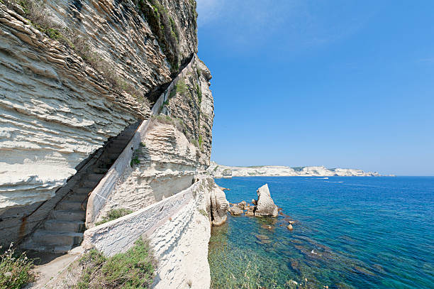 King Aragon's staircase under overhanging cliff. Bonifacio, Corsica, France.
