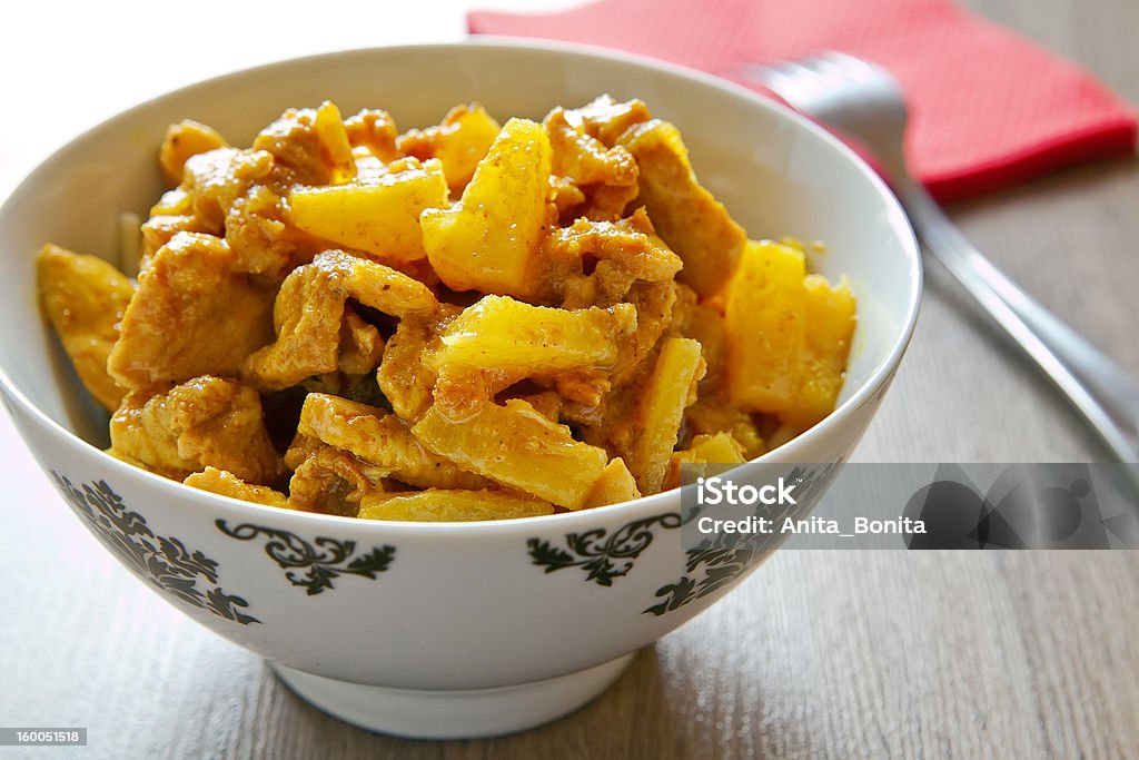 Chicken And Pineapple With Curry close-up pieces of chicken and pineapples with curry sauce Pineapple Stock Photo