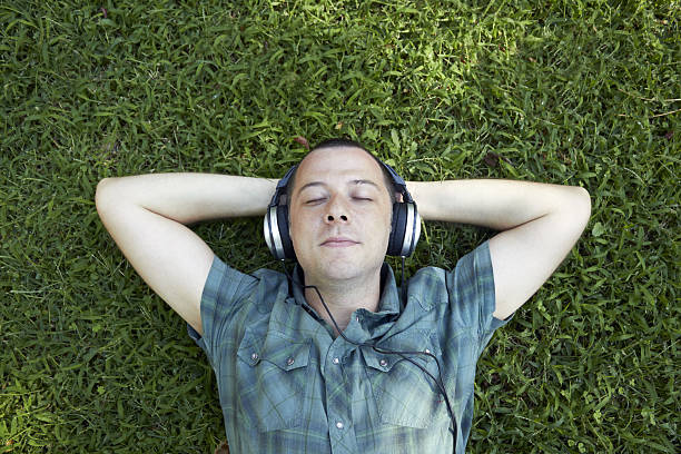 istock Young man listening to music 160052096
