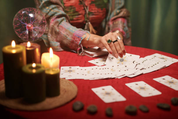 istock Sorceress Spreading Tarot Cards 1600527294