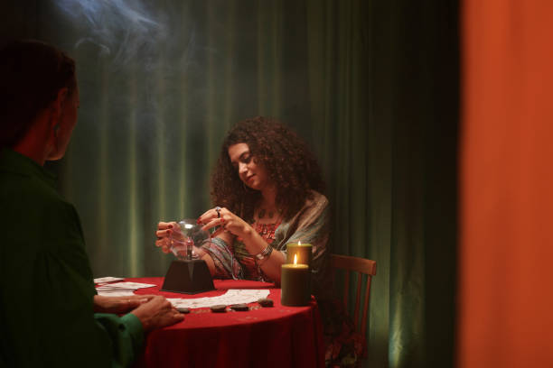 istock Sorceress Looking into Crystal Ball 1600527874
