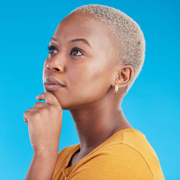 istock Thinking, decision and black woman with ideas, opportunity and choice on a blue studio background. Person, girl or model with problem solving, planning and solution with emoji, question and mindset 1600529565