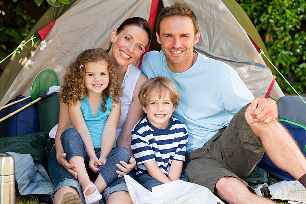 istock Adorable family camping together 160053236