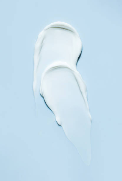 istock cosmetic smears cream texture on blue background 1600535080