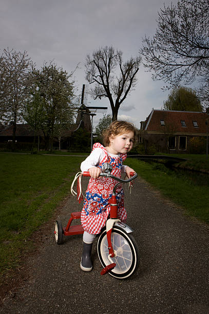 istock little girl on a red bike 160053511