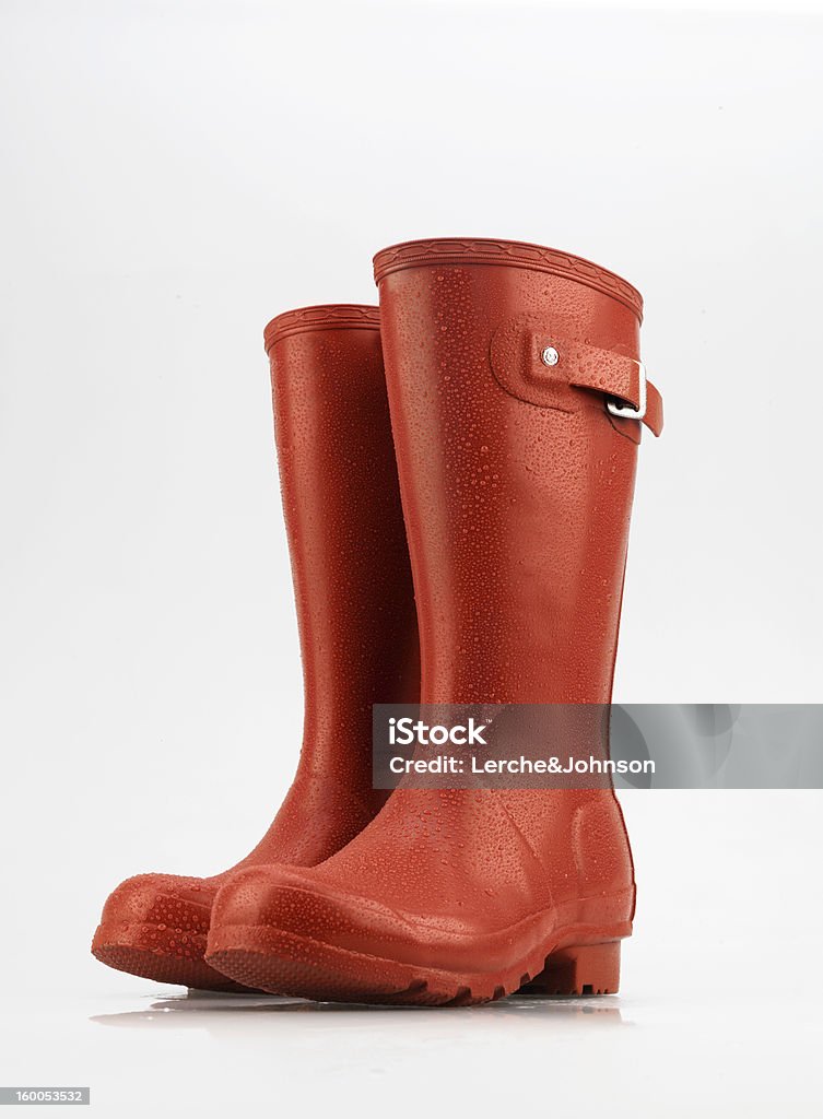 Chasseur de chaussures rouges wellies avec gouttes - Photo de Bottes en caoutchouc libre de droits