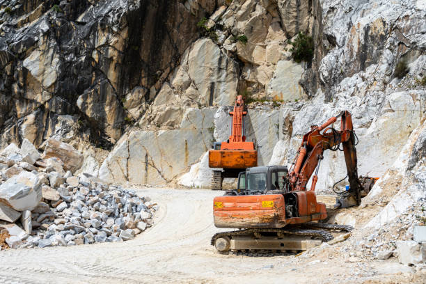 istock excavator at work in the carrara marble mountains 1600535615