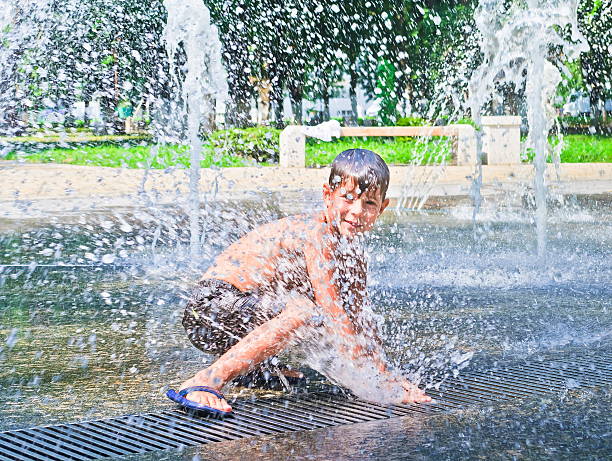 istock Boy is bathed in the fountain 160053746