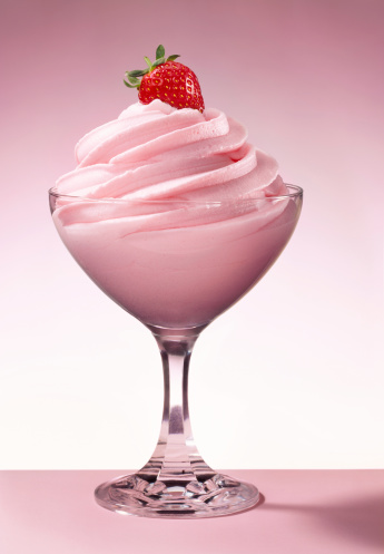 Delicious strawberry ice cream dessert, with a fresh strawberry on the top