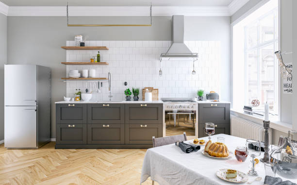 istock Classic elegant interior - a modern, but classic kitchen with a gray and white wall background, full dining table and French-style windows 1600541808