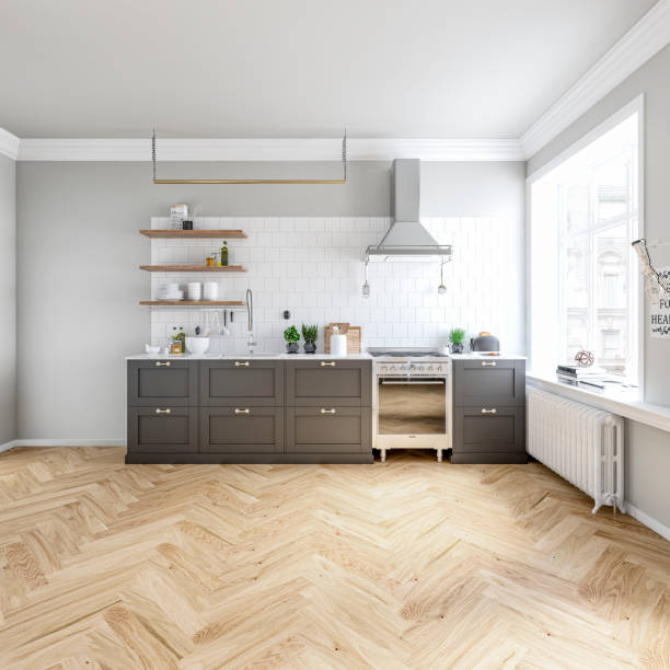 Classic elegant interior - a modern, but classic kitchen with a gray and white wall background, French-style windows - empty space for presenting furniture and appliances Empty classic elegant kitchen interior with a white and gray wall background, a dark gray low kitchen cabinets, a stainless steel kitchen hood over a stove, hardwood shelves with plates and accessories on white square tiled backsplash, kitchen counter with decoration and spices on the herringbone hardwood floor. Empty space for presenting a refrigerator on one side of the kitchen and empty space for tables and chairs in front of french-style windows with decoration (lights, books) on one side. 3D rendered image. stove stock pictures, royalty-free photos & images