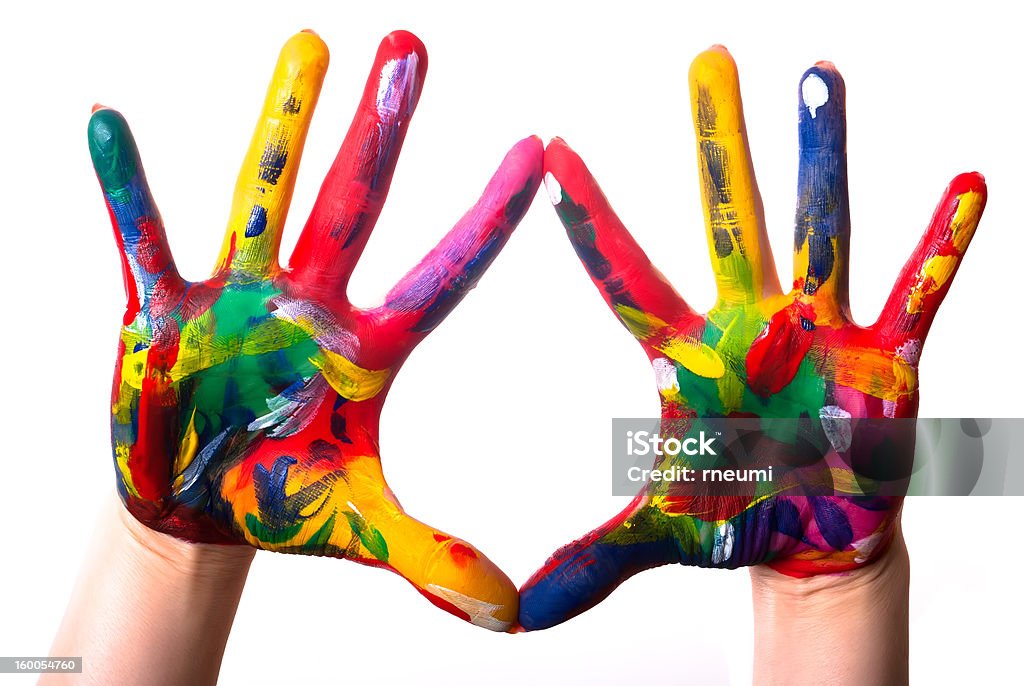 two colorful hands two painted colorful hands against white background Art And Craft Stock Photo