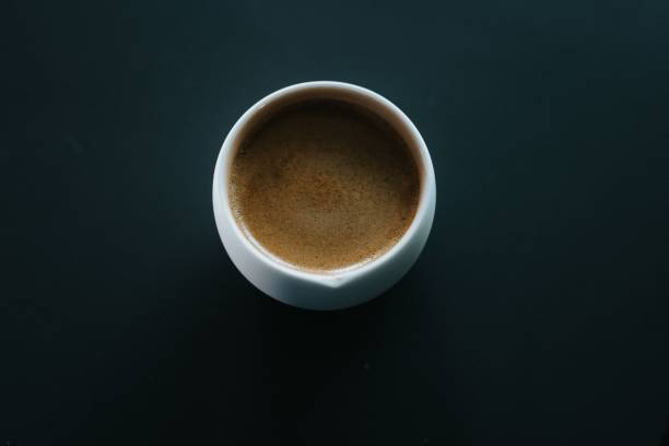 istock a coffee cup sits on a table, and it looks like it has just been 1600548305