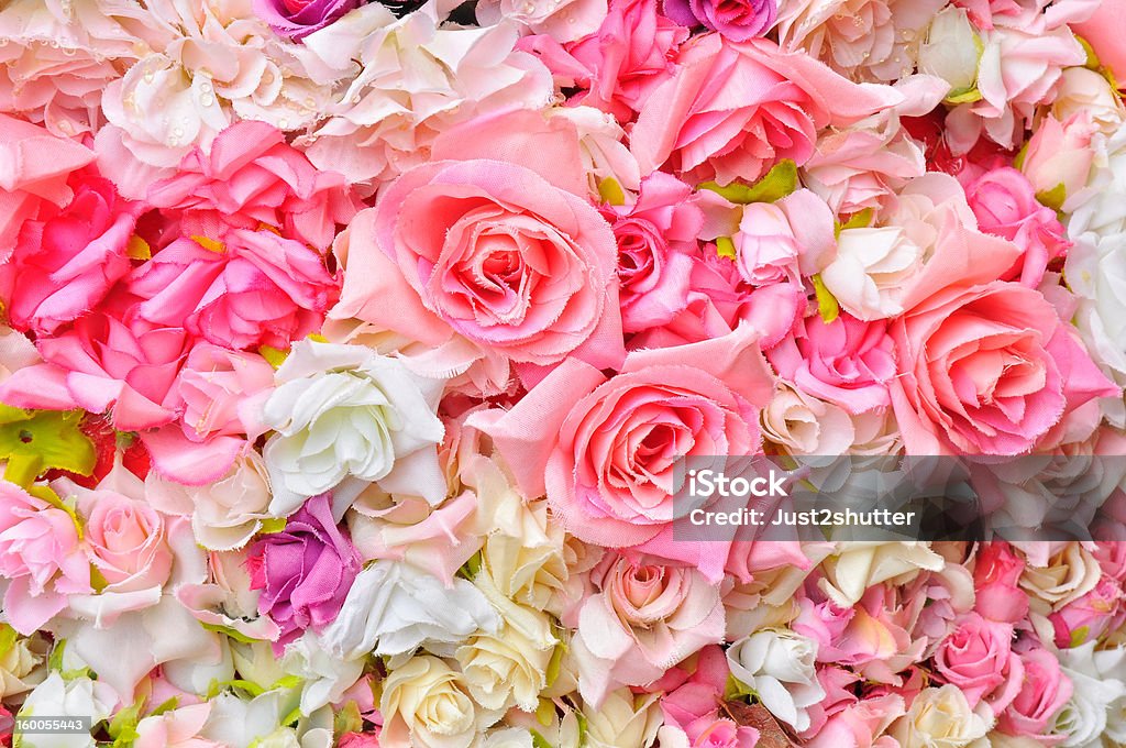 Artificial flowers background Artificial rose flowers background Arrangement Stock Photo