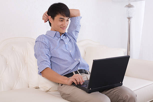 istock Handsome young man relaxing with hand behind head 160057050