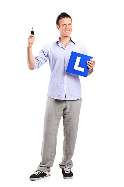 istock Happy man holding a car key and L plate 160057790