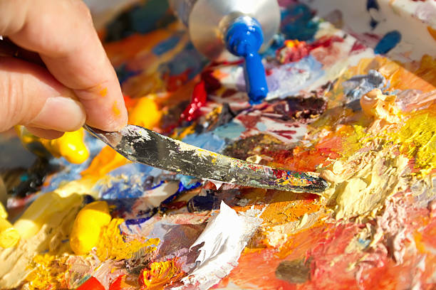 istock mixing oil paints with a brush 160058123