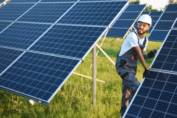 istock Indian man in uniform working near solar panel. 1600581284