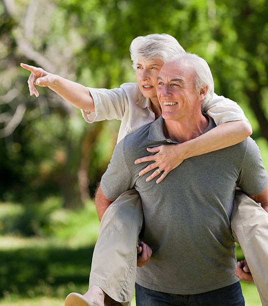 istock Man giving wife a piggyback 160058469
