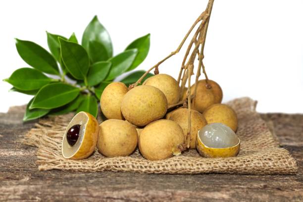 istock Longan fruit put on the old wooden with sack. 1600590673