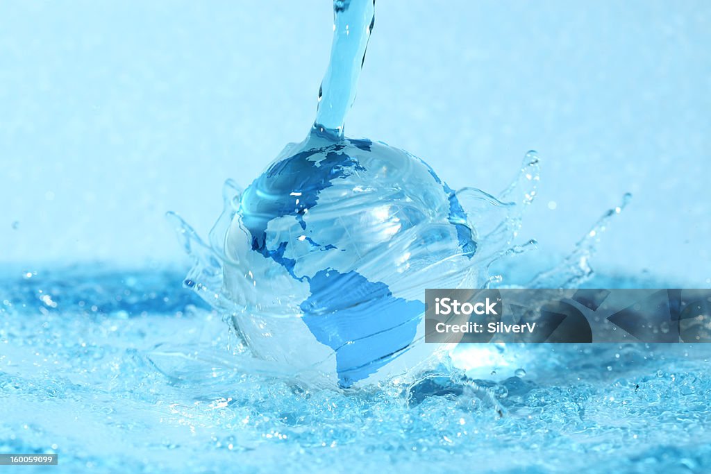 Glass globe in water Planet - Space Stock Photo