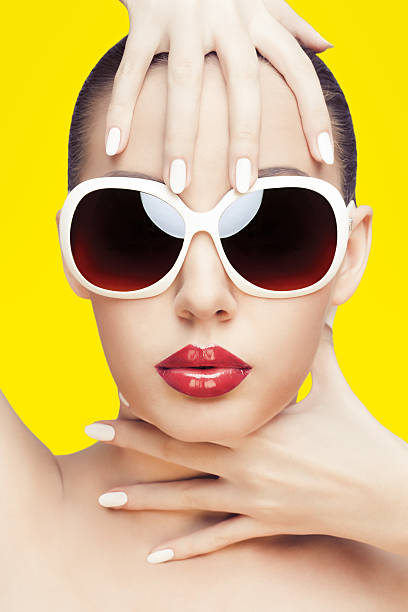 istock young woman wearing sunglasses 160059126