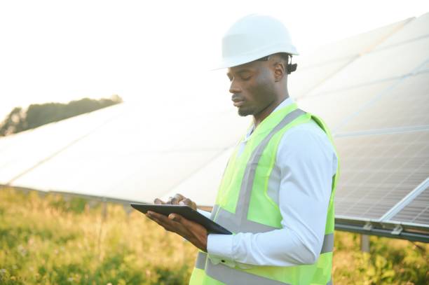 istock Photovoltaic Green Energy Technology. Worker At Solar Panel Plant 1600594449
