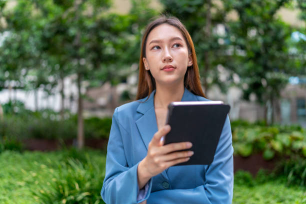 istock Efficiency Unleashed. Young Asian Businesswoman Empowers Business on the Go With A Digital Tablet 1600596544