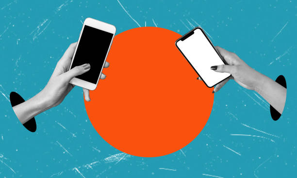 istock Two hands holding cell phones transfer money between accounts. Transferring money using an electronic wallet. 1600610197