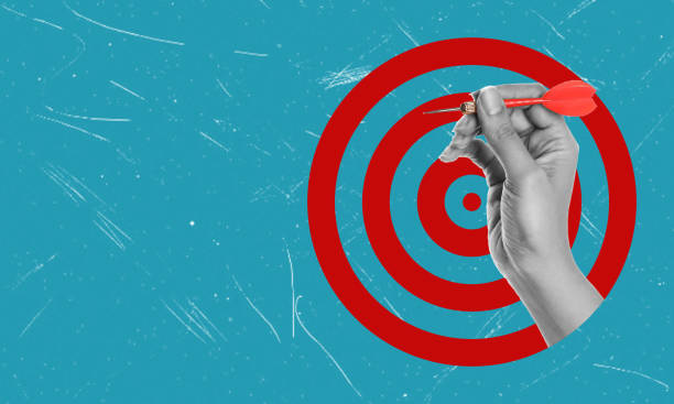 istock Businessman holding a dart while aiming at a target business concept of targeting, aiming, focusing, copy space. 1600610718