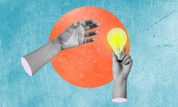 istock Creativity and new ideas in business. Hand holding a glowing light bulb. 1600610736