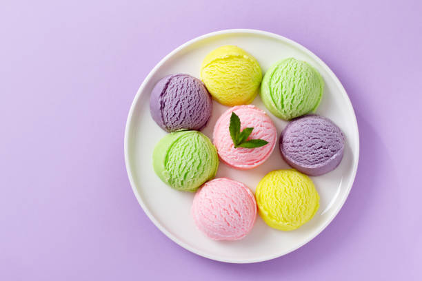 istock Pastel colored ice cream scoops on white plate, top view. 1600615103