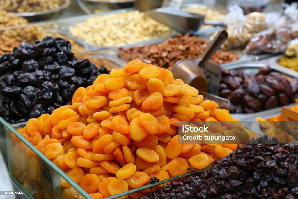 Dried apricot fruit in Israel Dried apricot fruit and prunes. Israeli cuisine at Mahane Yehuda Market (or shuk) in Jerusalem. Apricot Stock Photo