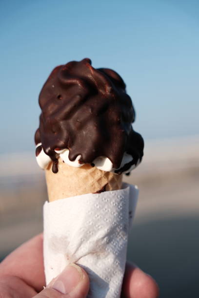istock Hand holding chocolate ice cream 1600621857
