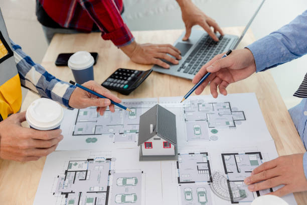 istock The engineering team discusses with colleagues. to examine the blueprints used to construct commercial buildings 1600630906
