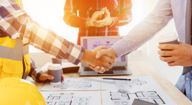 istock The engineering team discusses with colleagues. to examine the blueprints used to construct commercial buildings 1600630941