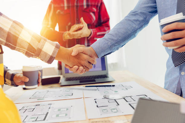 istock The engineering team discusses with colleagues. to examine the blueprints used to construct commercial buildings 1600630943
