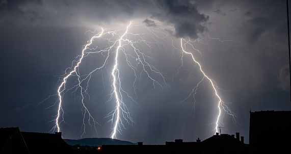 Lightning Strikes in the Mountains of Switzerland looks like a walking Men