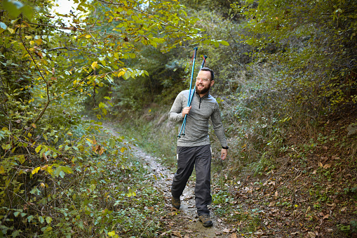 Trail Guiding Smiling Bearded Hiker Through Mountain