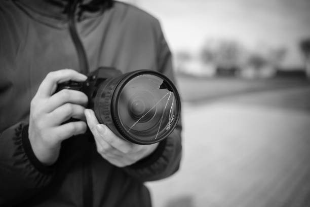 istock Broken lens filter on DSLR camera. Closeup, cracked photo-filter 1600642424