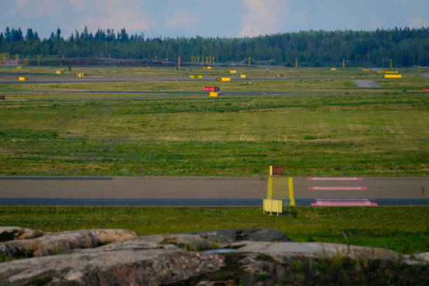 An Airport tarmac with taxiways. Runway signs and markings. stock photo