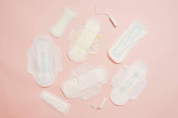 istock Different feminine sanitary napkins (sanitary pads) with tampon on pink background. Menstruation 1600645199