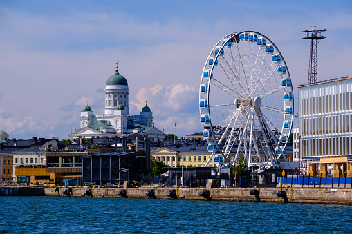 Helsinki / Finland - JUNE 27, 2023: A coastal view of downtown Helsinki during the summer time.