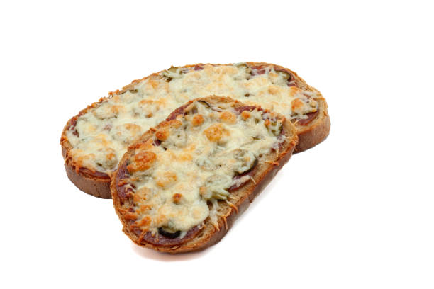 istock Two grilled cheese sandwich with cucumber and salami front ot the white background. 1600670475