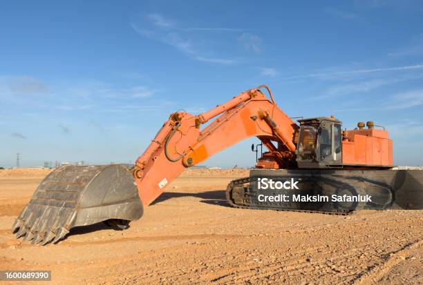 Backhoe Digging Sand Excavator On Earthmoving At Open Pit Mining Backhoe Dig Sand And Gravel ...