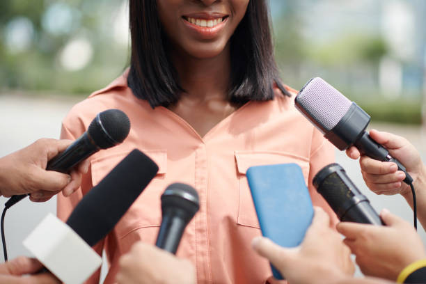 istock Smiling Politician Talking to Press 1600708526