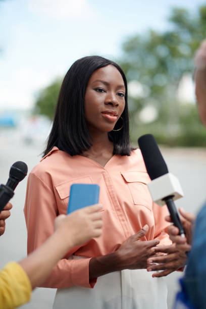 istock Elegant Woman Talking to Journalists 1600708536
