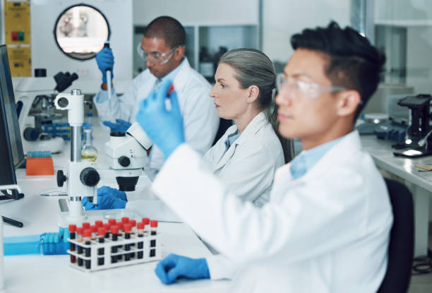 istock Science, laboratory and team  with blood work for doctor research and study in clinic. Lab, analysis and healthcare professional with innovation and investigation for covid test of dna scientist 1600720084