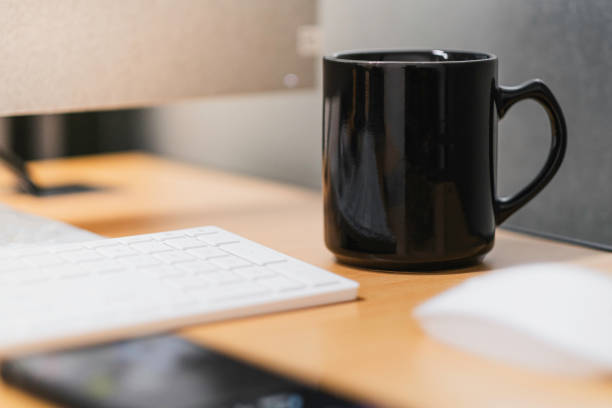 istock Black mug coffee on the desk 1600733235